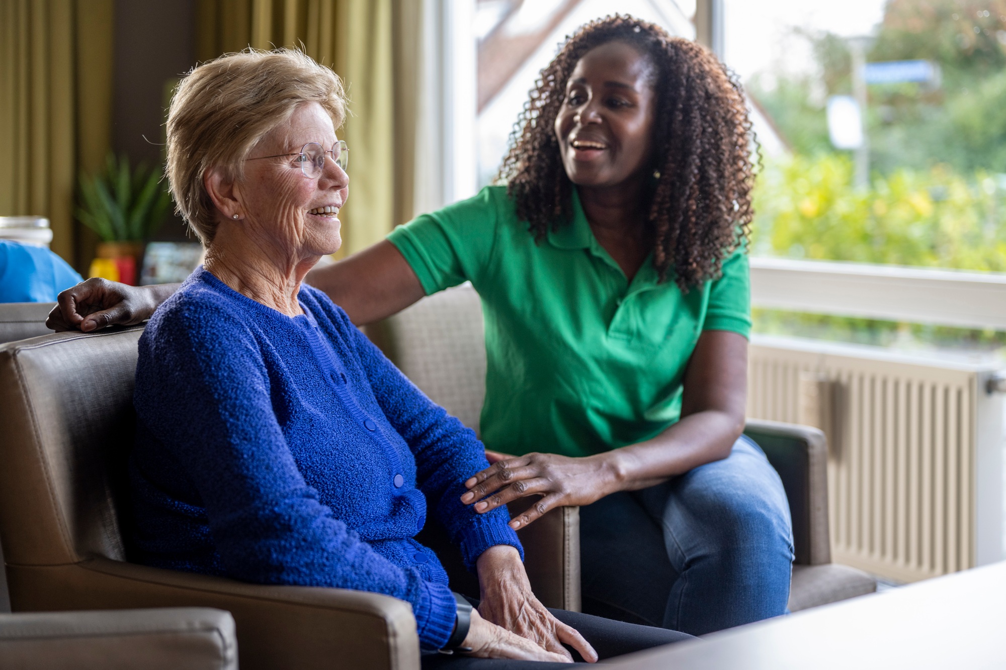 Helper caring for elderly lady